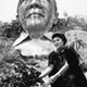 Marcos’ wife Imelda lays flowers at the bust of her late husband in 1992.